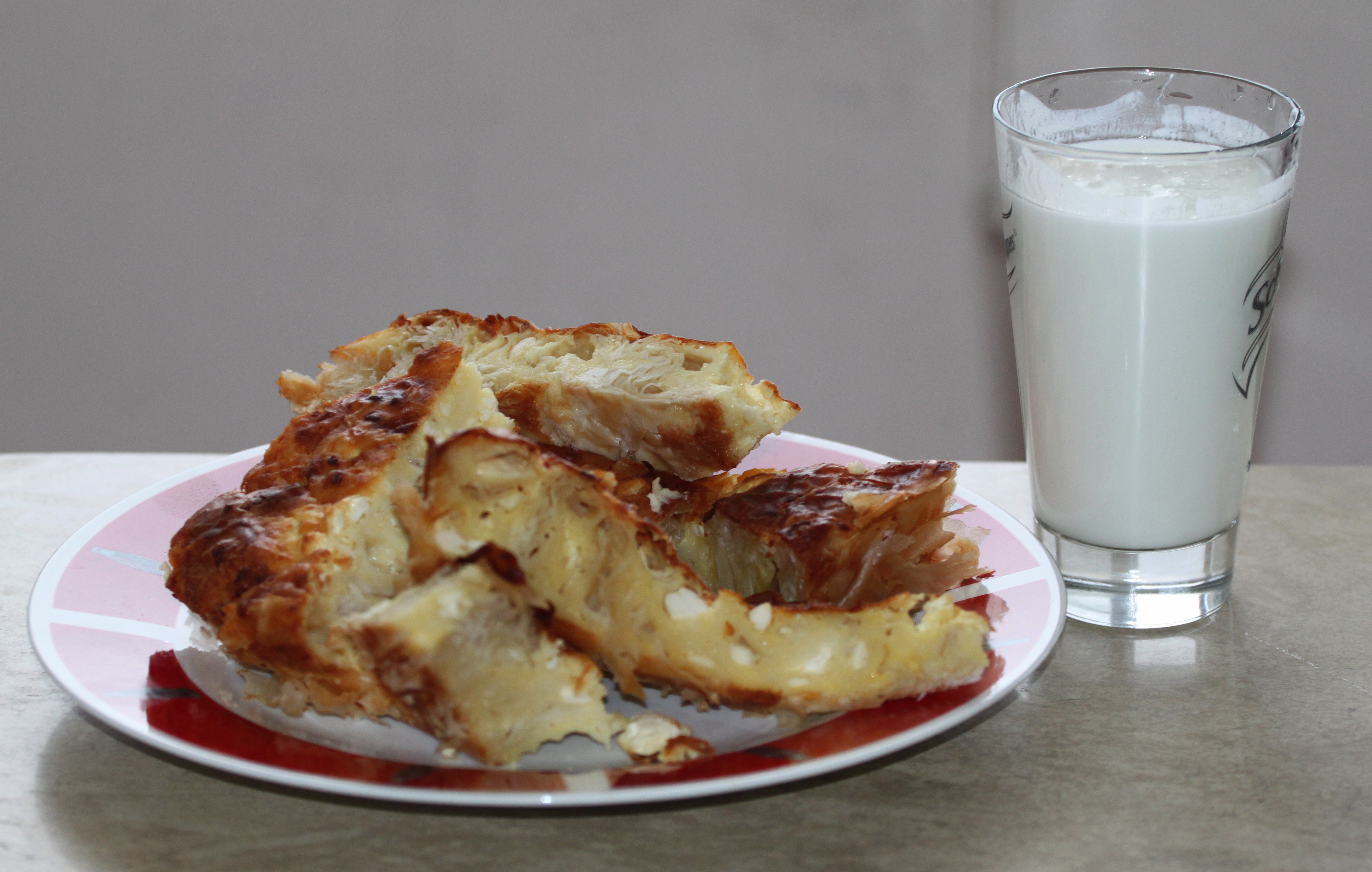 Golden baked Bulgarian banitsa pastry with fresh sirene cheese